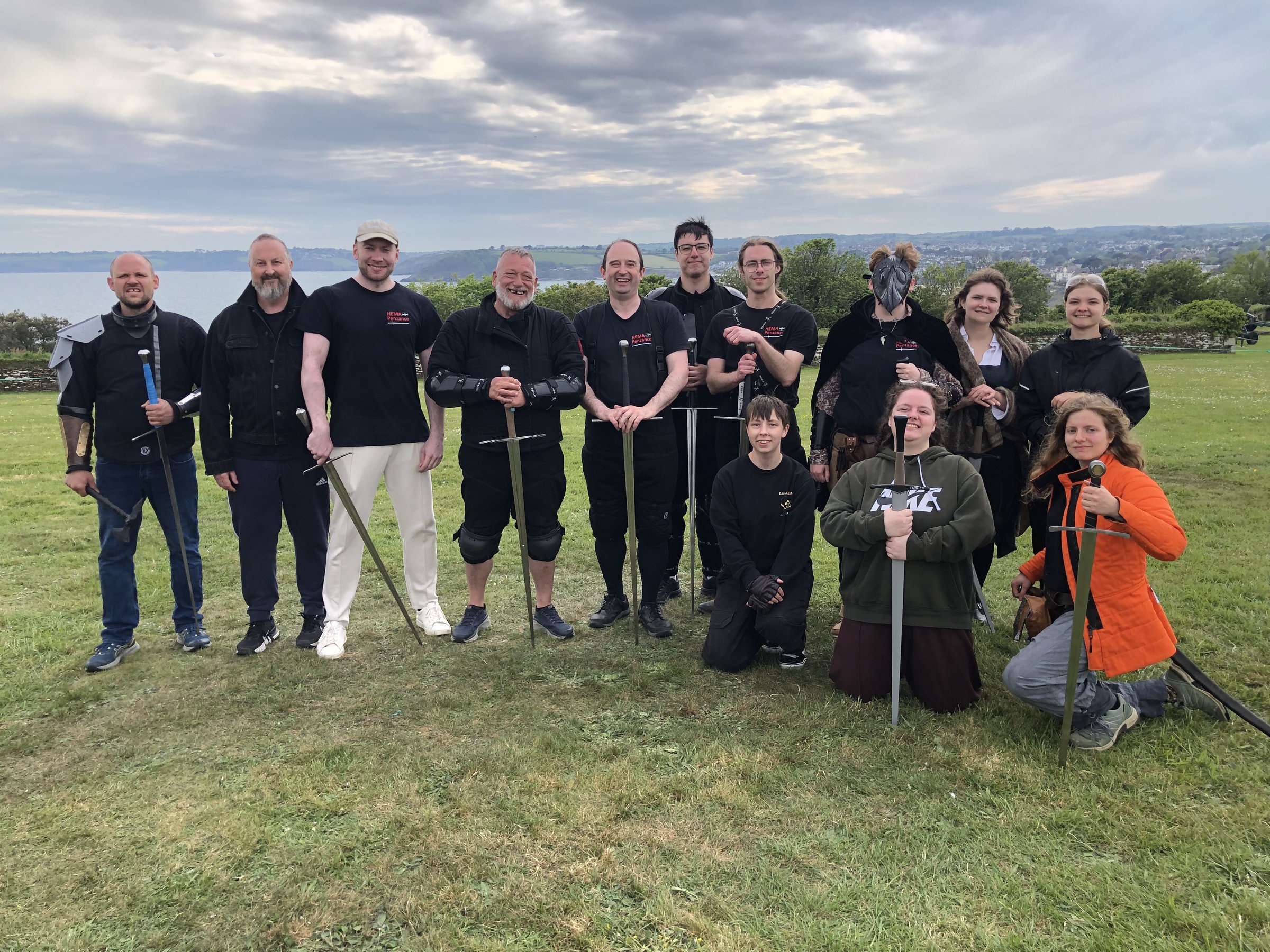 HEMA Penzance team group photo on the grass at Pendennis Castle for FABLEFUSION 2026